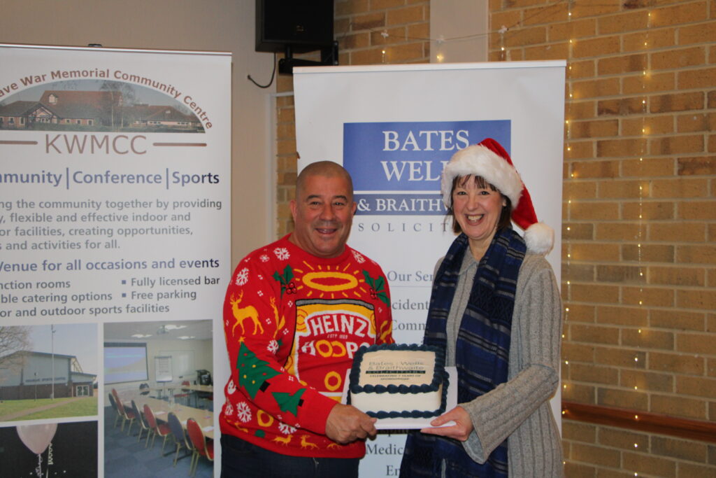 Stuart Lawson (General Manager) presenting a cake to celebrate 7 years of Bates Wells and Braithwaites sponsorship of the KWMCC Networking events
